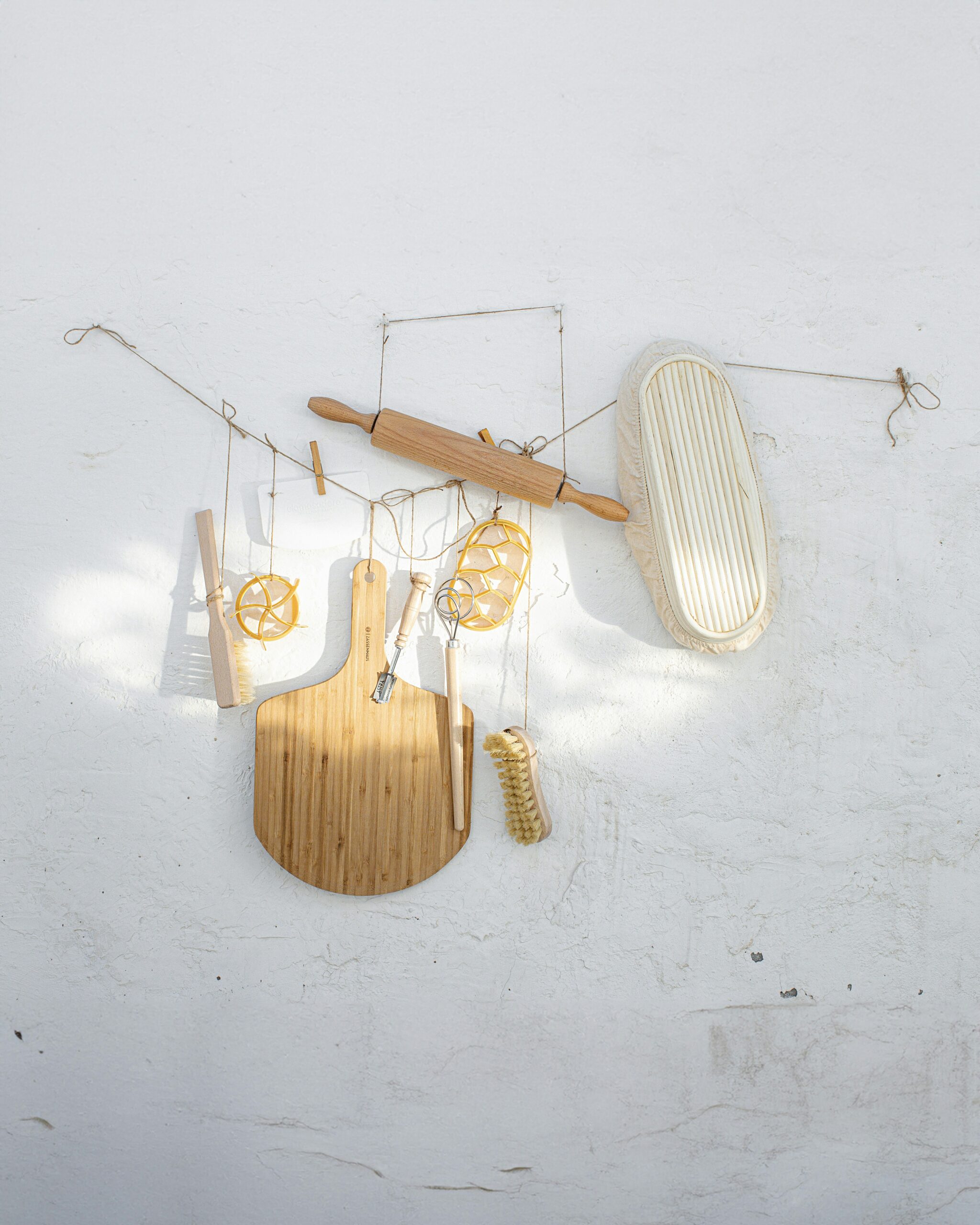 a white wall with various items hanging on it